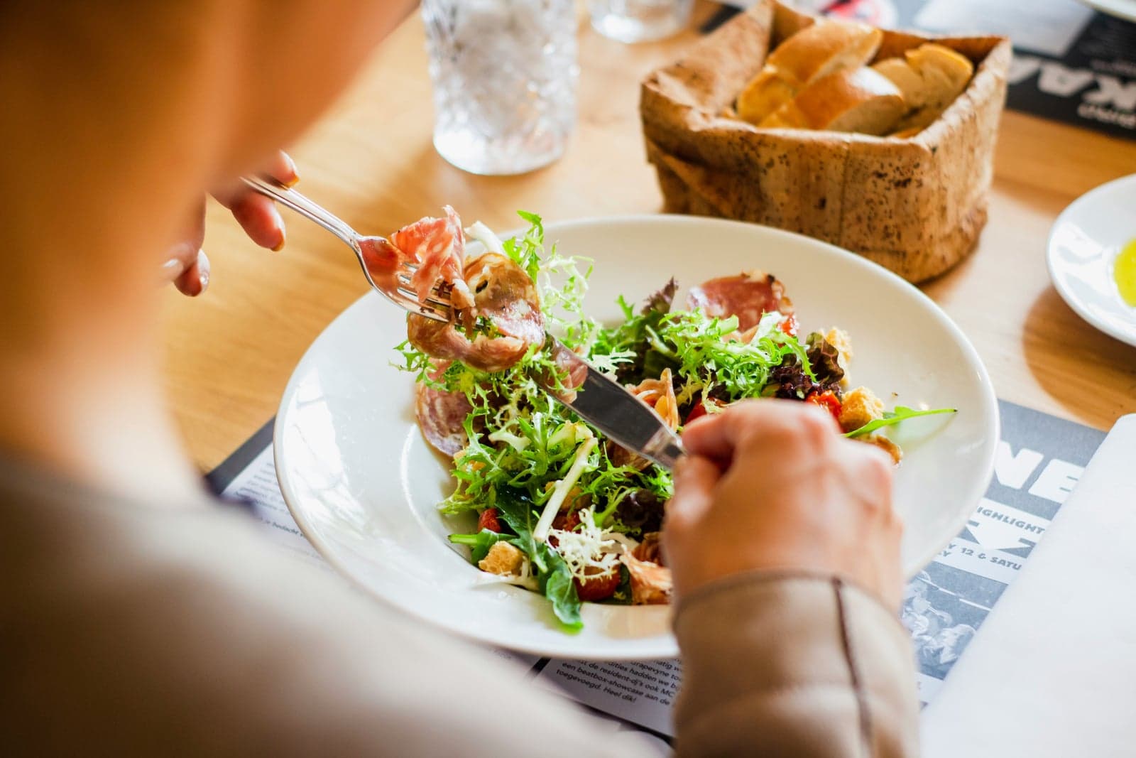 A creator photographing a dish at a local restaurant