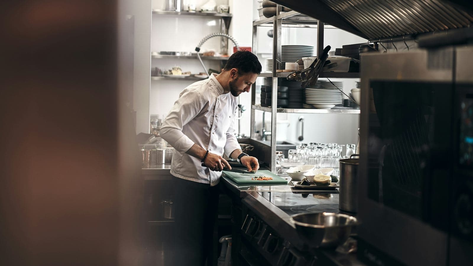 A chef plating at his station