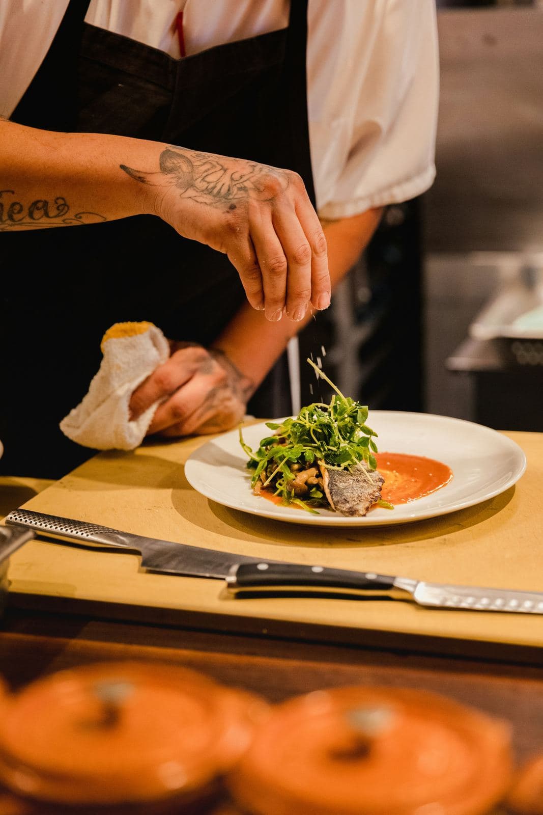 A chef plating a dish